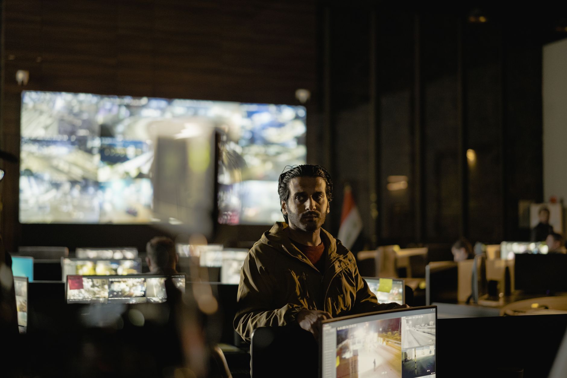 Team monitoring screens in a security control room