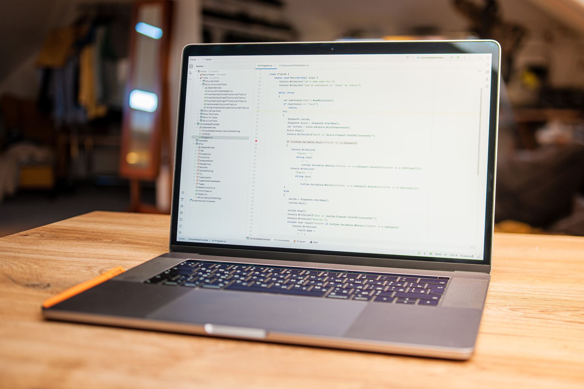 Laptop with code on screen on a wooden desk