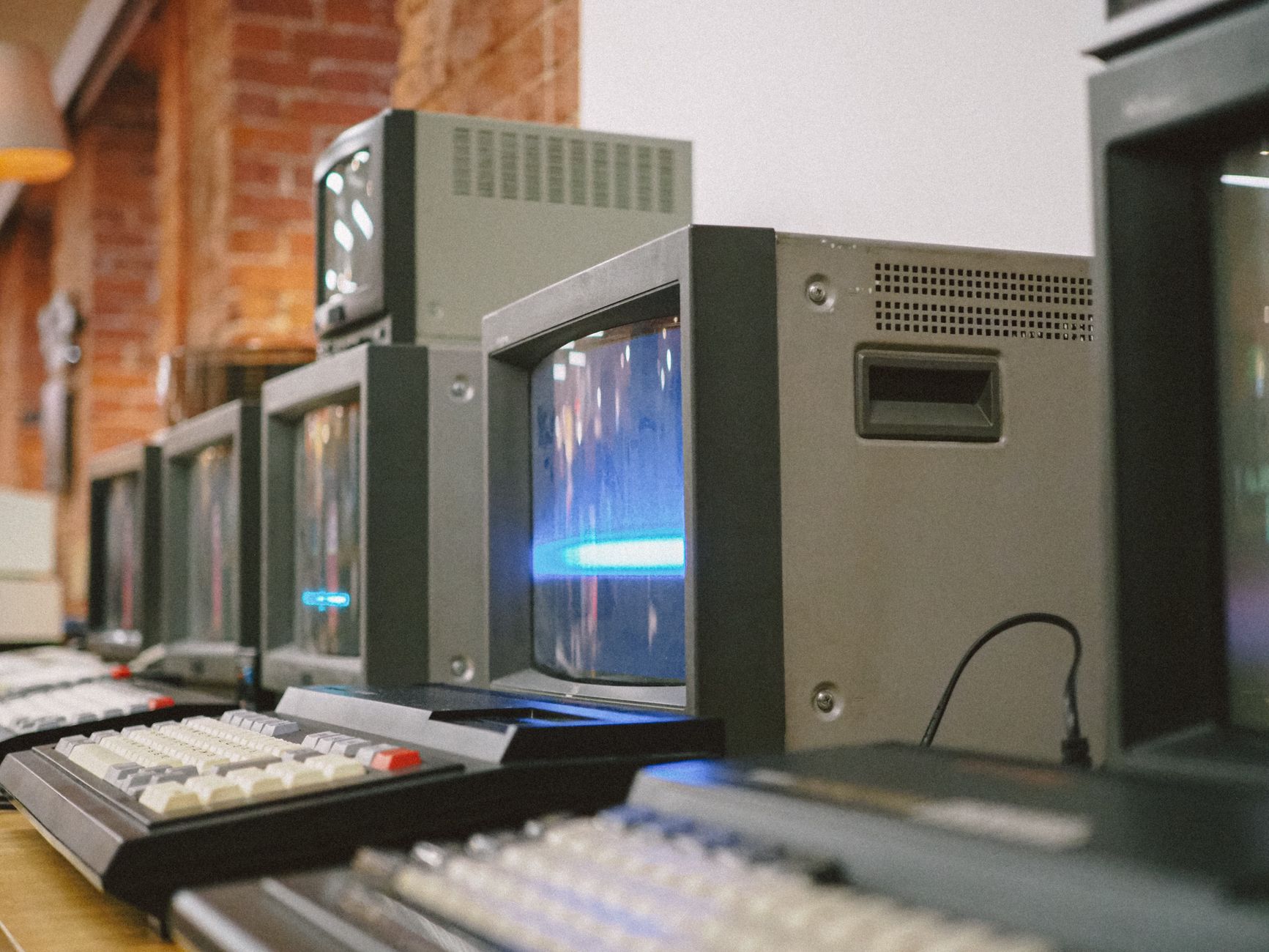 Row of vintage CRT computer monitors